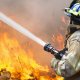 Depositphotos 73851741-stock-photo-firefighters-battle-a-wil