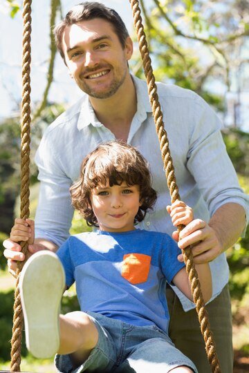 Happy-father-pushing-boy-swing 13339-242511