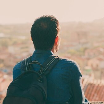 Tourist-man-looking-on-the-city-center-during-his-trip-in-it